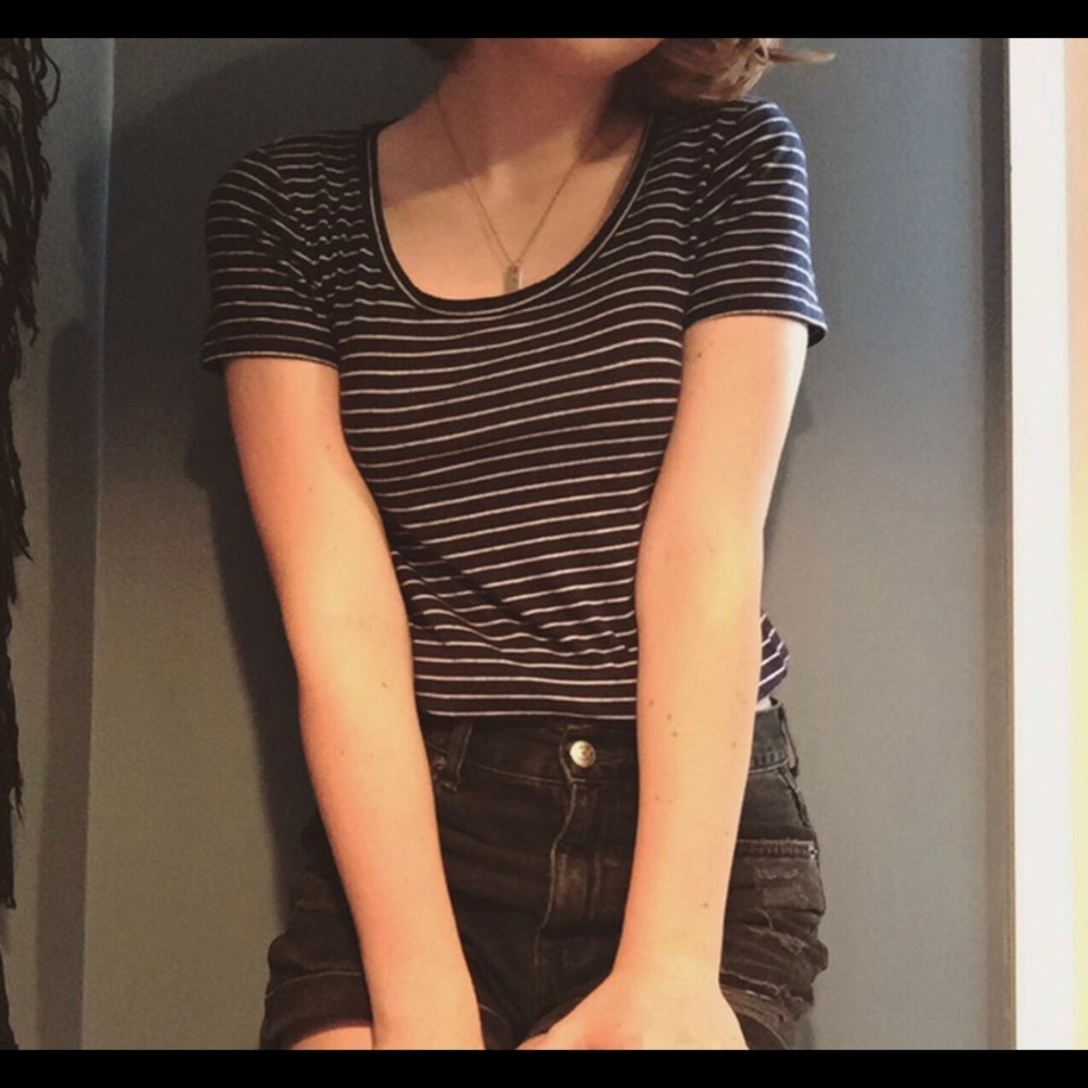 Navy and white swoop neck striped shirt.